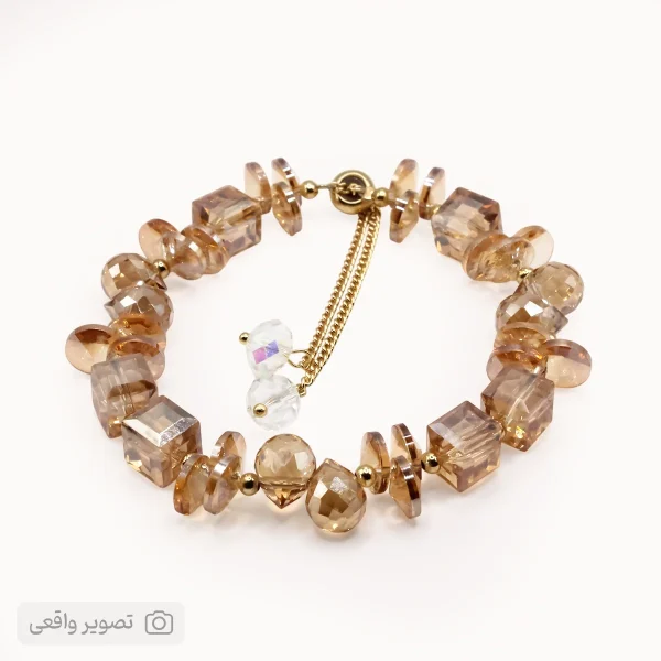 دستبند دخترانه کریستالی طرح سواروسکی (کرمی) | فروشگاه اینترنتی زابزبا